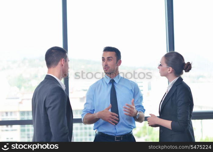 Group of happy young business people in a meeting at office