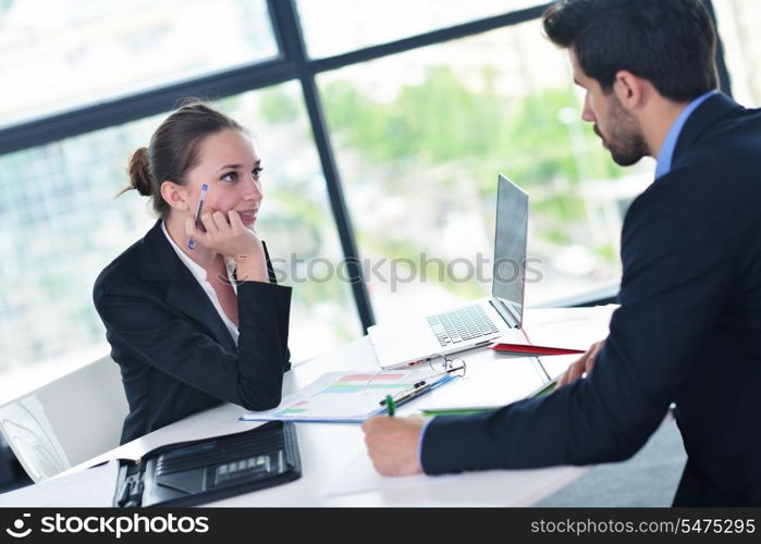 Group of happy young business people in a meeting at office