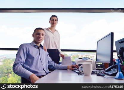 Group of happy young business people in a meeting at office