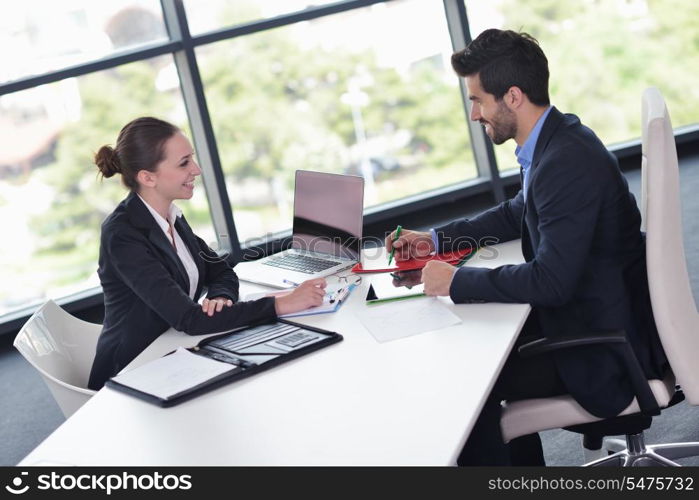 Group of happy young business people in a meeting at office