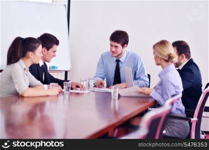 Group of happy young business people in a meeting at office