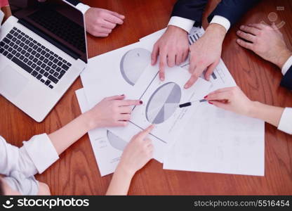 Group of happy young business people in a meeting at office