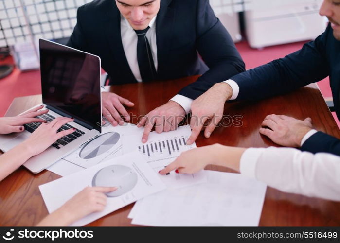 Group of happy young business people in a meeting at office