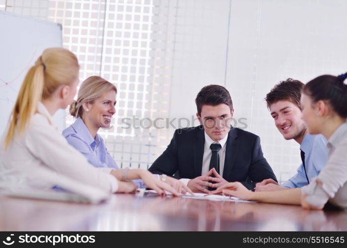 Group of happy young business people in a meeting at office