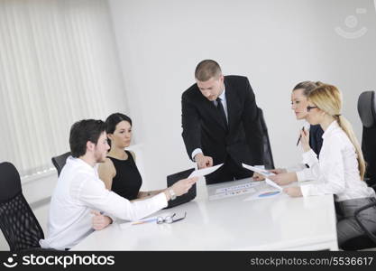 Group of happy young business people in a meeting at office