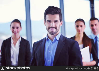 Group of happy young business people in a meeting at office