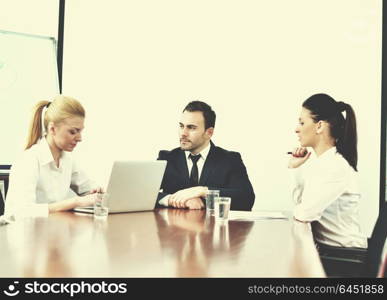 Group of happy young business people in a meeting at office