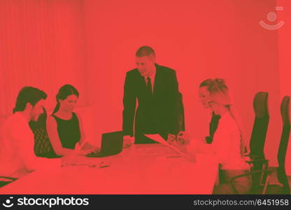 Group of happy young business people in a meeting at office