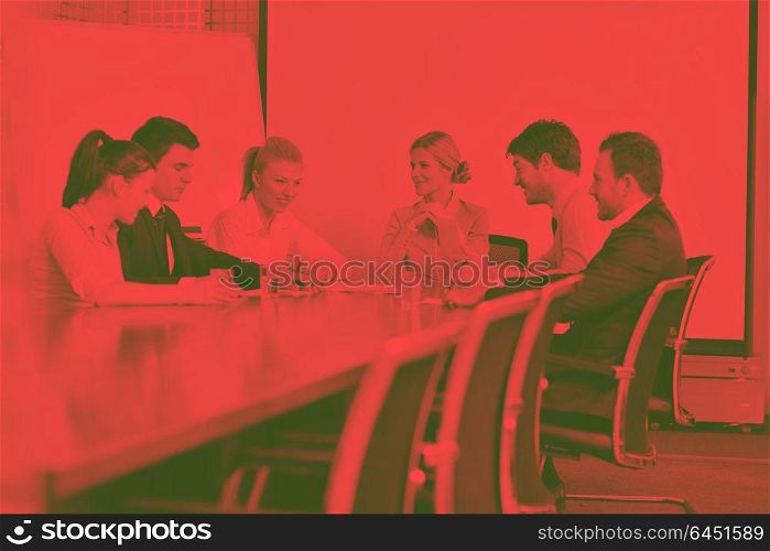 Group of happy young business people in a meeting at officeduo tone