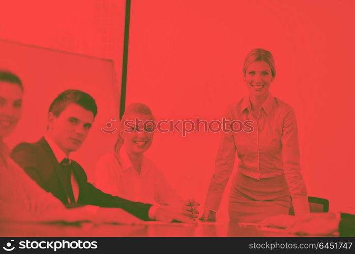 Group of happy young business people in a meeting at officeduo tone