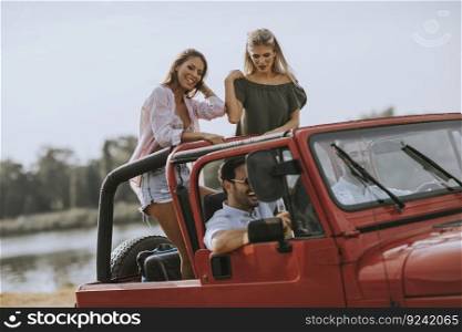 Group of happy young people enjoying road trip