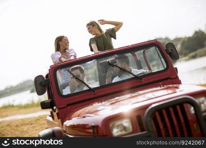 Group of happy young people enjoying road trip