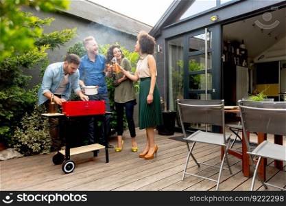 Group of happy young people have barbecue in the backyard