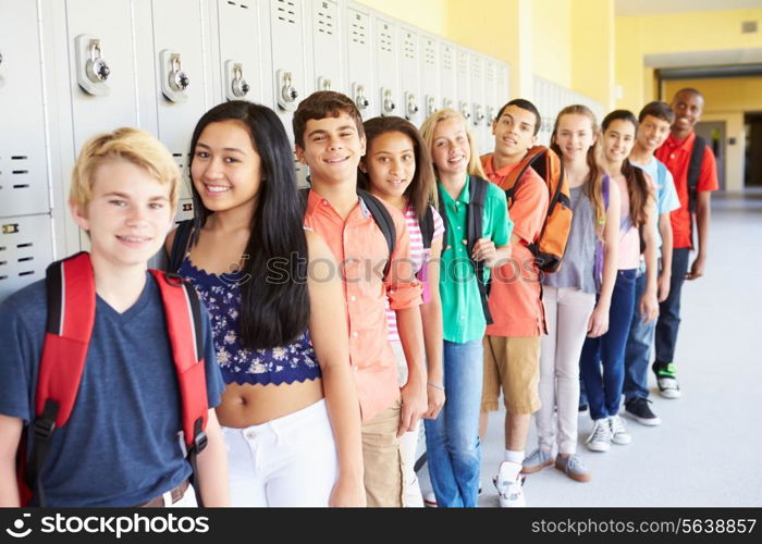 Group Of High School Students Standing In Corridor