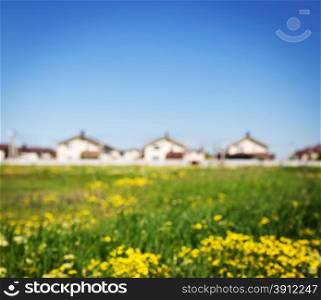Group of houses in the countryside. Defocused photo