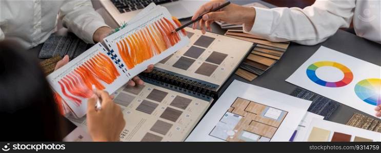 Group of interior designer team in meeting, discussing with engineer on interior design and planning for house project blueprint and model, choosing various mood board materials. Insight. Group of interior designer team in meeting and discussing. Insight