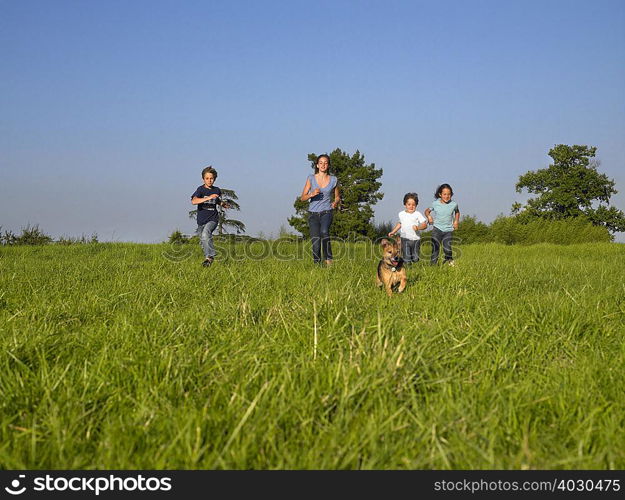 Group of kids running in a field