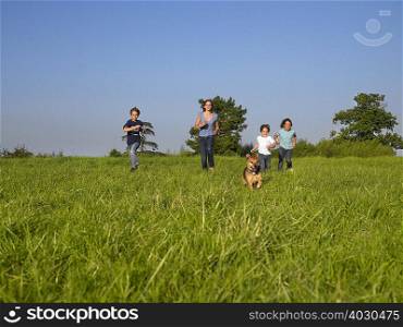 Group of kids running in a field