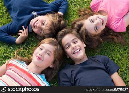 Group of little kids lying on grass