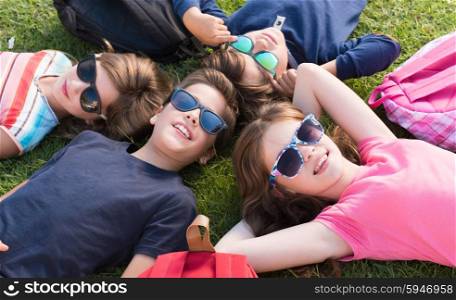 Group of little kids lying on grass