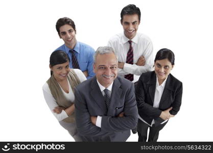 Group of male and female executives smiling with arms crossed