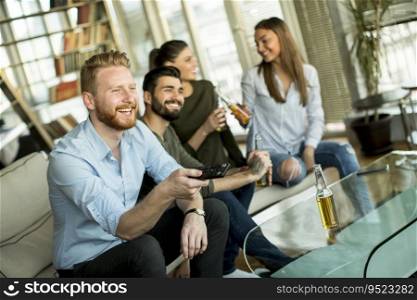 Group of male and female friends having fun at home
