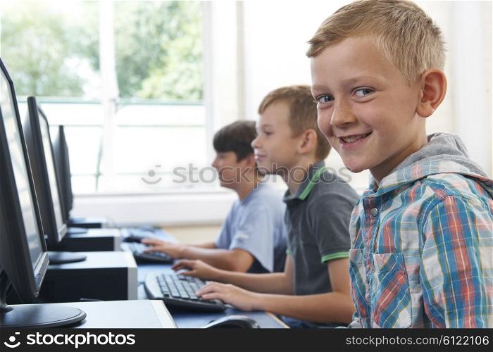 Group Of Male Elementary School Children In Computer Class