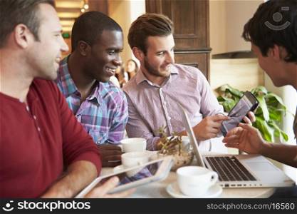 Group Of Male Friends Meeting In Cafe Restaurant