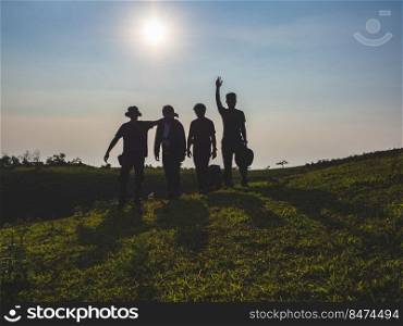group of men backpackers are happy and joyful after successful hiking.