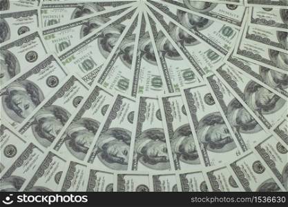 Group of money stack of 100 US dollars banknotes a lot of is arranged in a beautiful