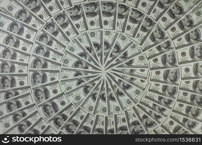 Group of money stack of 100 US dollars banknotes a lot of is arranged in a beautiful circle