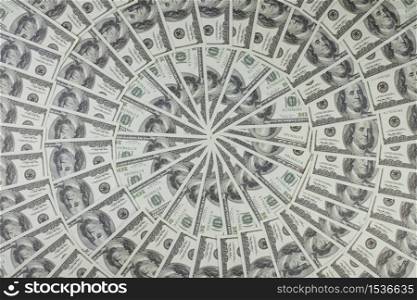 Group of money stack of 100 US dollars banknotes a lot of is arranged in a beautiful circle