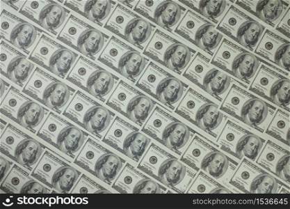 Group of money stack of 100 US dollars banknotes a lot of is arranged in a beautiful