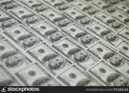 Group of money stack of 100 US dollars banknotes a lot of is arranged in a beautiful, selective focus