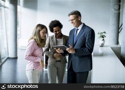 Group of multiethnic business people using digital tablet at meeting in the office