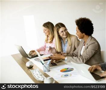Group of multiethnic business women working together at the office