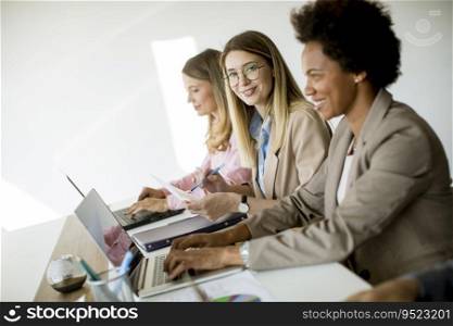 Group of multiethnic business women working together at the office