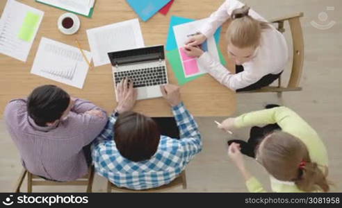 Group of multiethnic busy people working in an office, top view