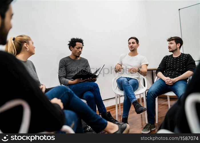 Group of multiethnic creative business people working on a project and having a brainstorming meeting. Team work and brainstorming concept.