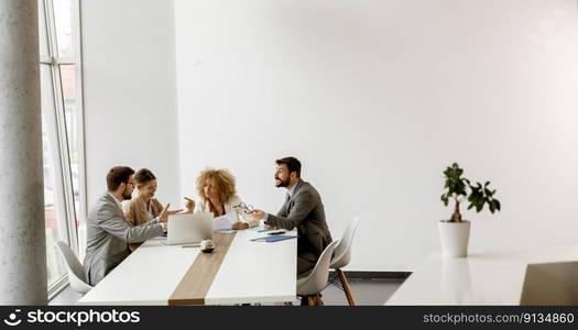 Group of multiethnic young business people working together in the office