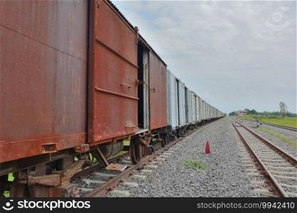 Group of Old train bogies on rails with sky background