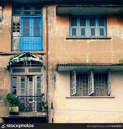 Group of old wooden window and antique door at facade of old house at Ho Chi Minh city, Vietnam