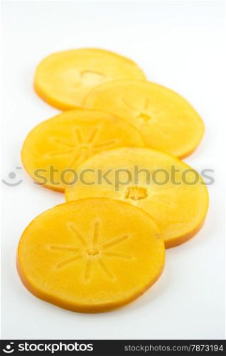 group of orange persimmon slices isolated on white background&#xA;&#xA;