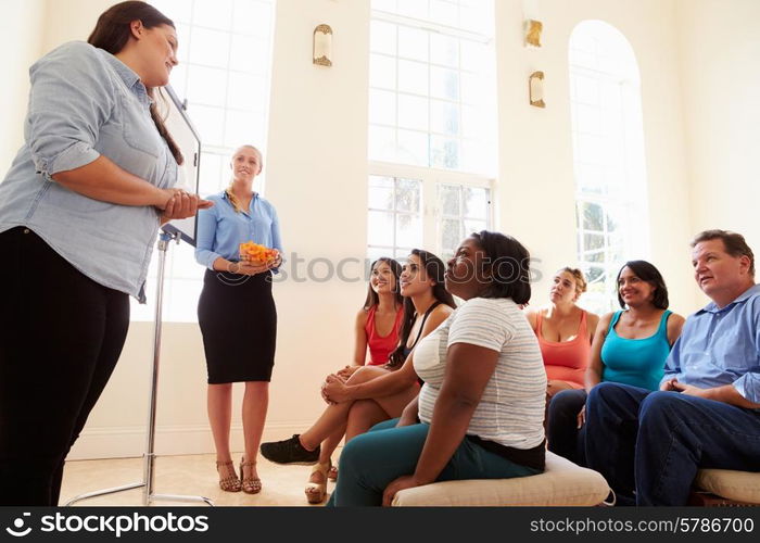 Group Of Overweight People Attending Diet Club