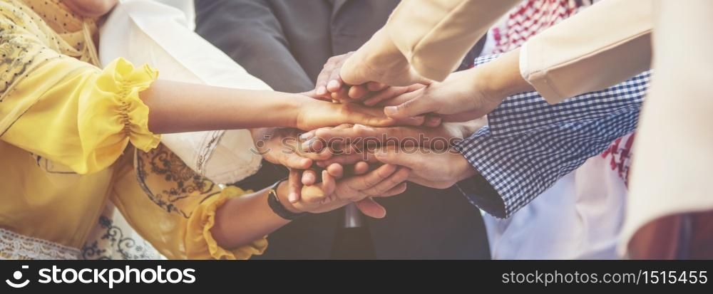 Group of people diversity multiethnic teamwork collaboration team meeting communication Unified team concept. Business people hands together diversity multiethnic diverse culture partner team meeting