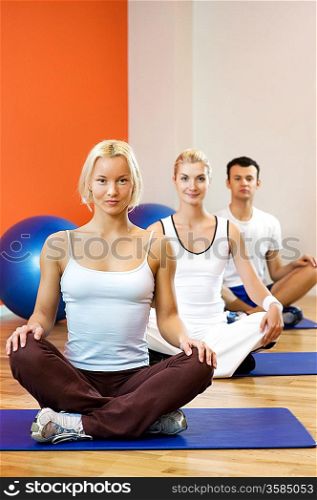 Group of people doing yoga exercise