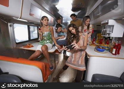 Group of people enjoying in a camper van
