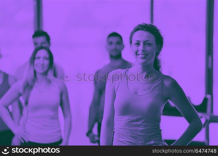Group of people exercising at the gym. Group of people exercising at the gym and stretching duo tone