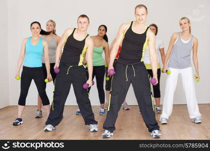 Group Of People Exercising In Dance Studio