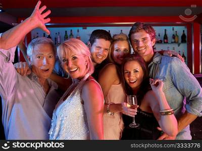 Group Of People Having Fun In Busy Bar
